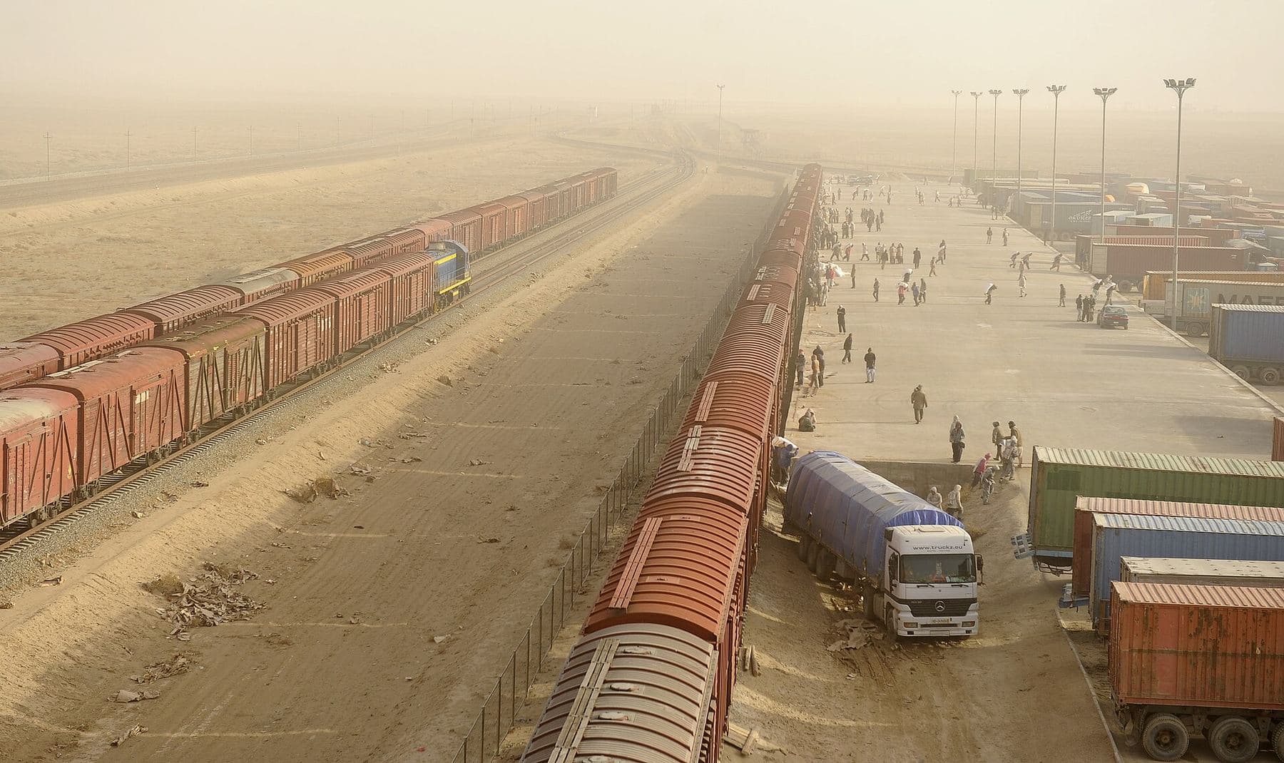 Freight wagons and trucks at the Hairatan rail terminal in northern Afghanistan
